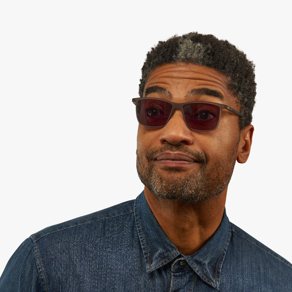 Person wearing København Grey sunglasses