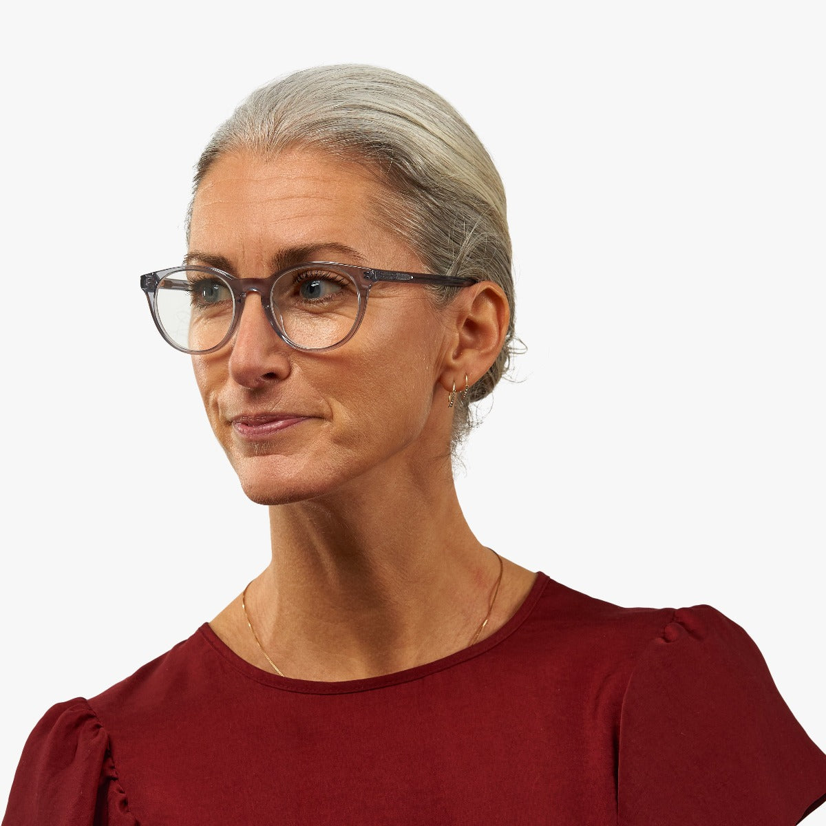 Person wearing Örebro Crystal White glasses
